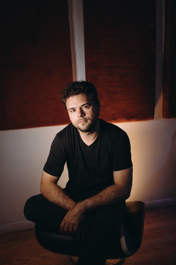 Ilya Truskovsky seated in the studio